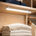 Luma rechargeable motion sensor closet light installed under a pale oak shelf